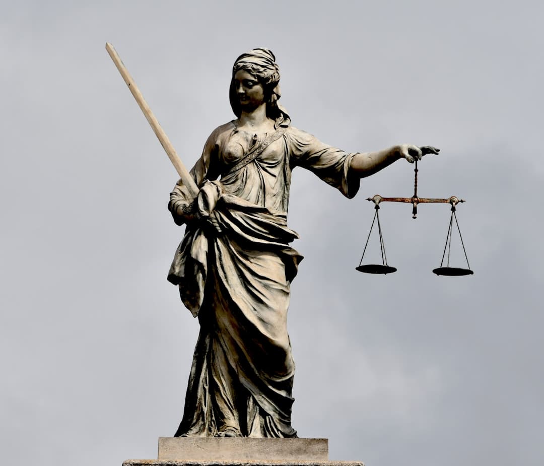 california support animal. A statue of lady justice holding a sword and a scale