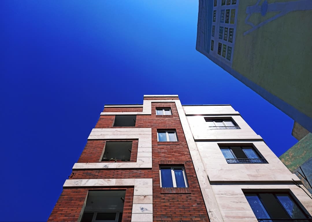 verify support animal letter. Looking up at a tall brick building with windows