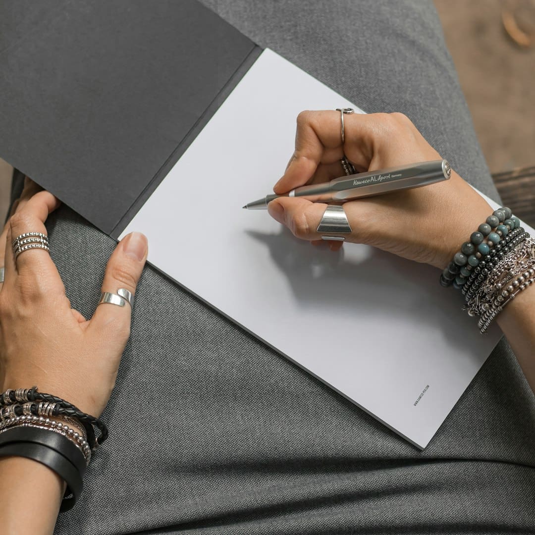 support animal fraud laws — a woman is writing on a piece of paper