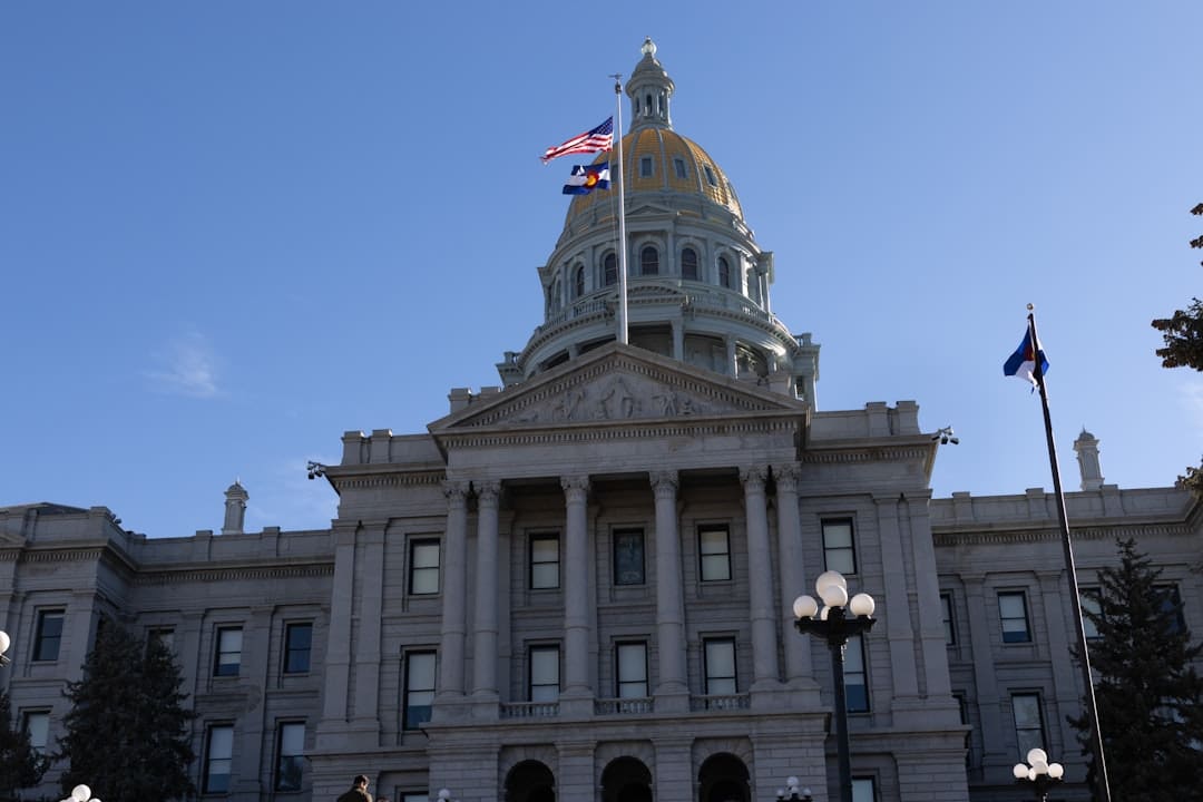 california support animal — Colorado state capitol building with flags flying.