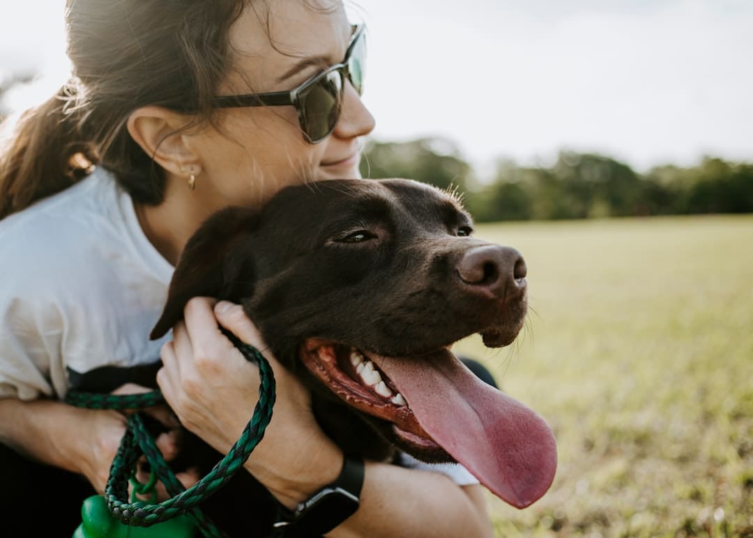 support animal registry — woman hugging a dog