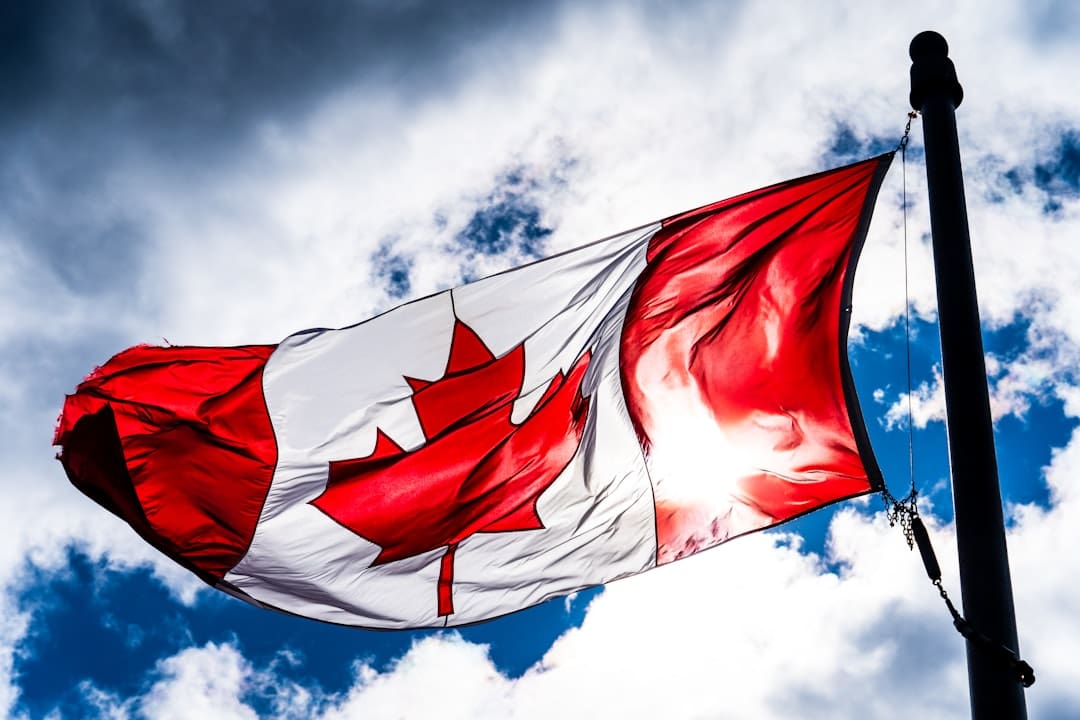 support animal rights Canada — red and white flag under blue sky during daytime